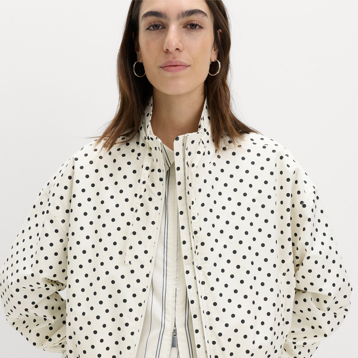 Woman wearing polka-dot jacket