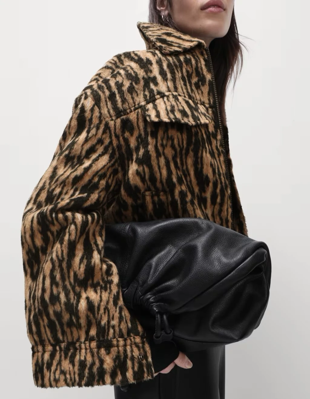 Woman wearing leopard-print coat at M&S