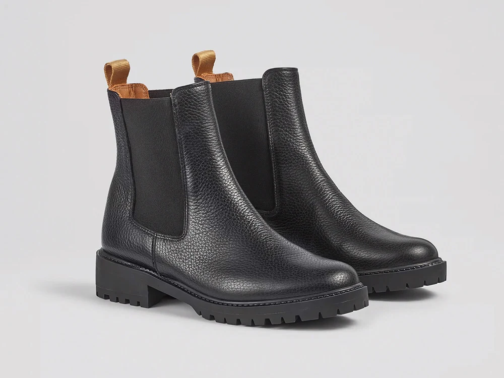 A pair of black leather Chelsea boots