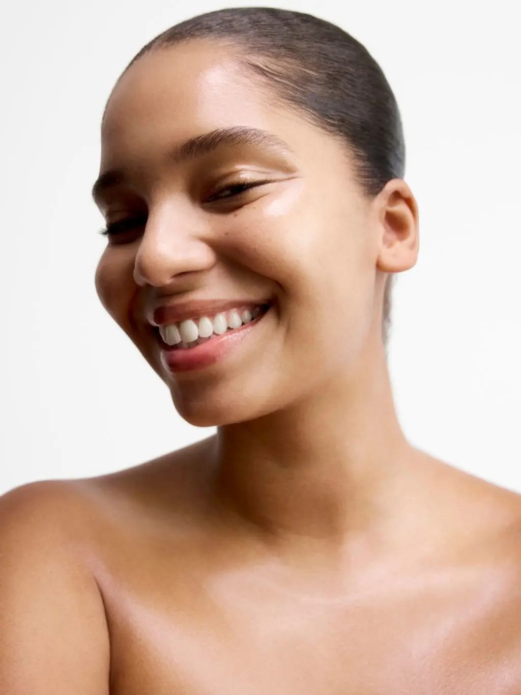 A close up beauty shot of a young woman looking away to the left