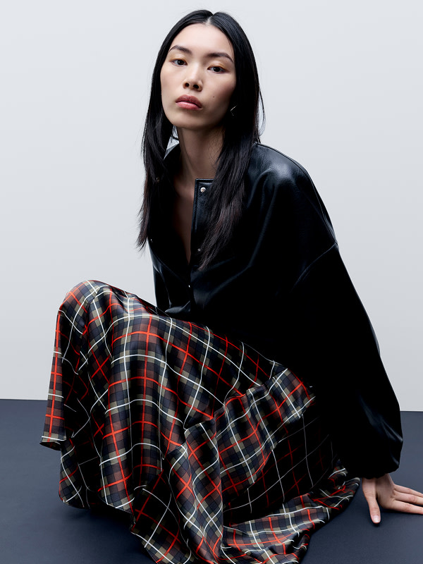 Woman wearing red checked skirt