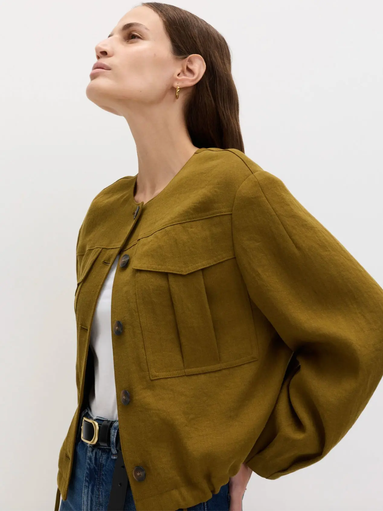 Woman wearing jacket with blue jeans