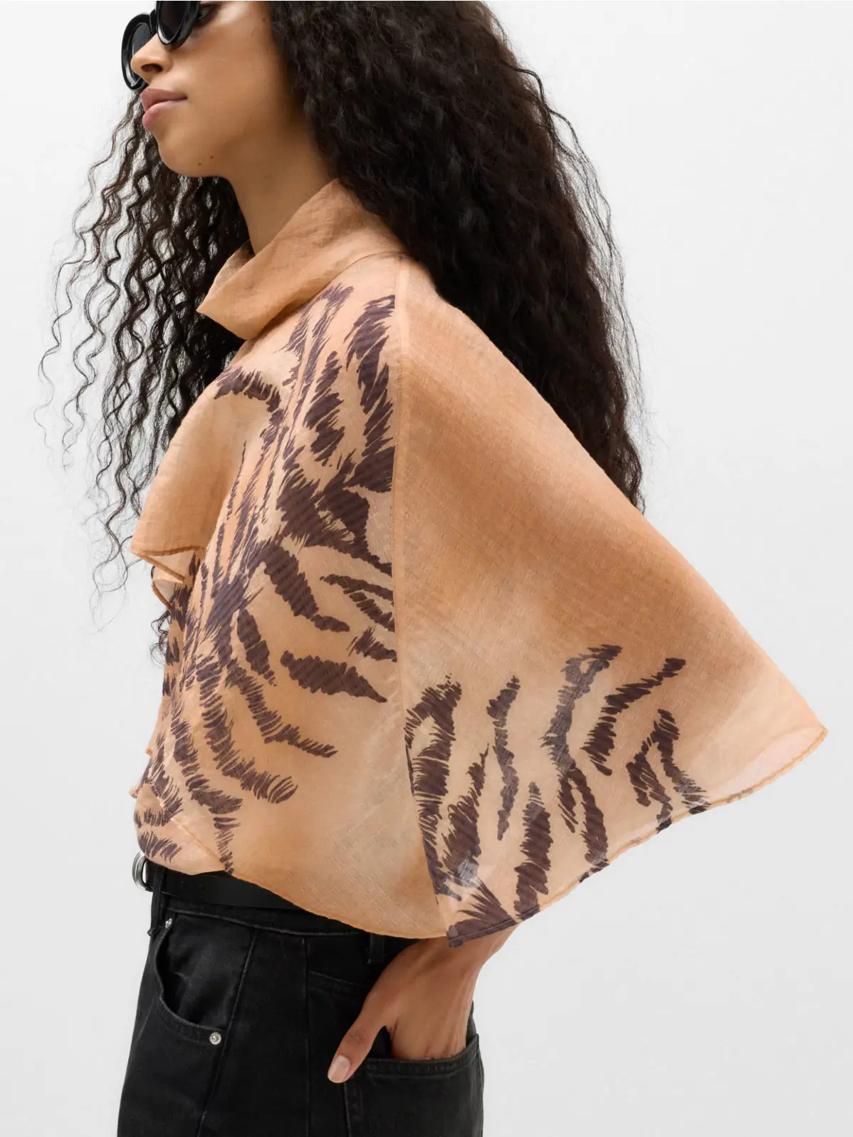 Woman wearing animal-print blouse