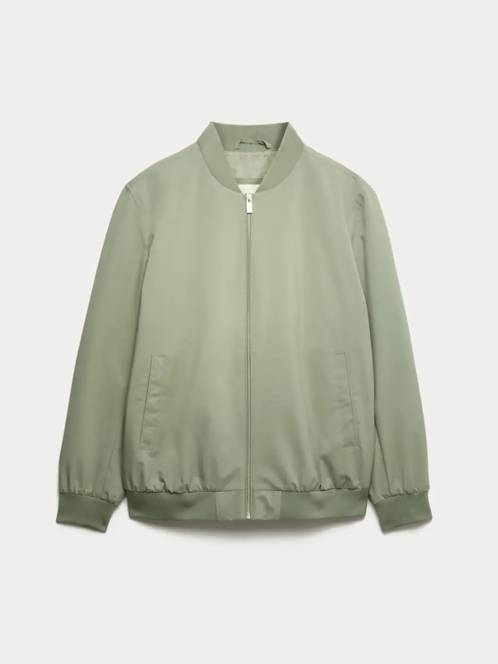 A cutout of a green bomber jacket