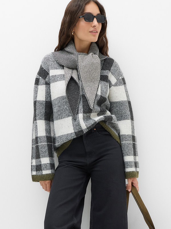 Woman in checked top and jeans