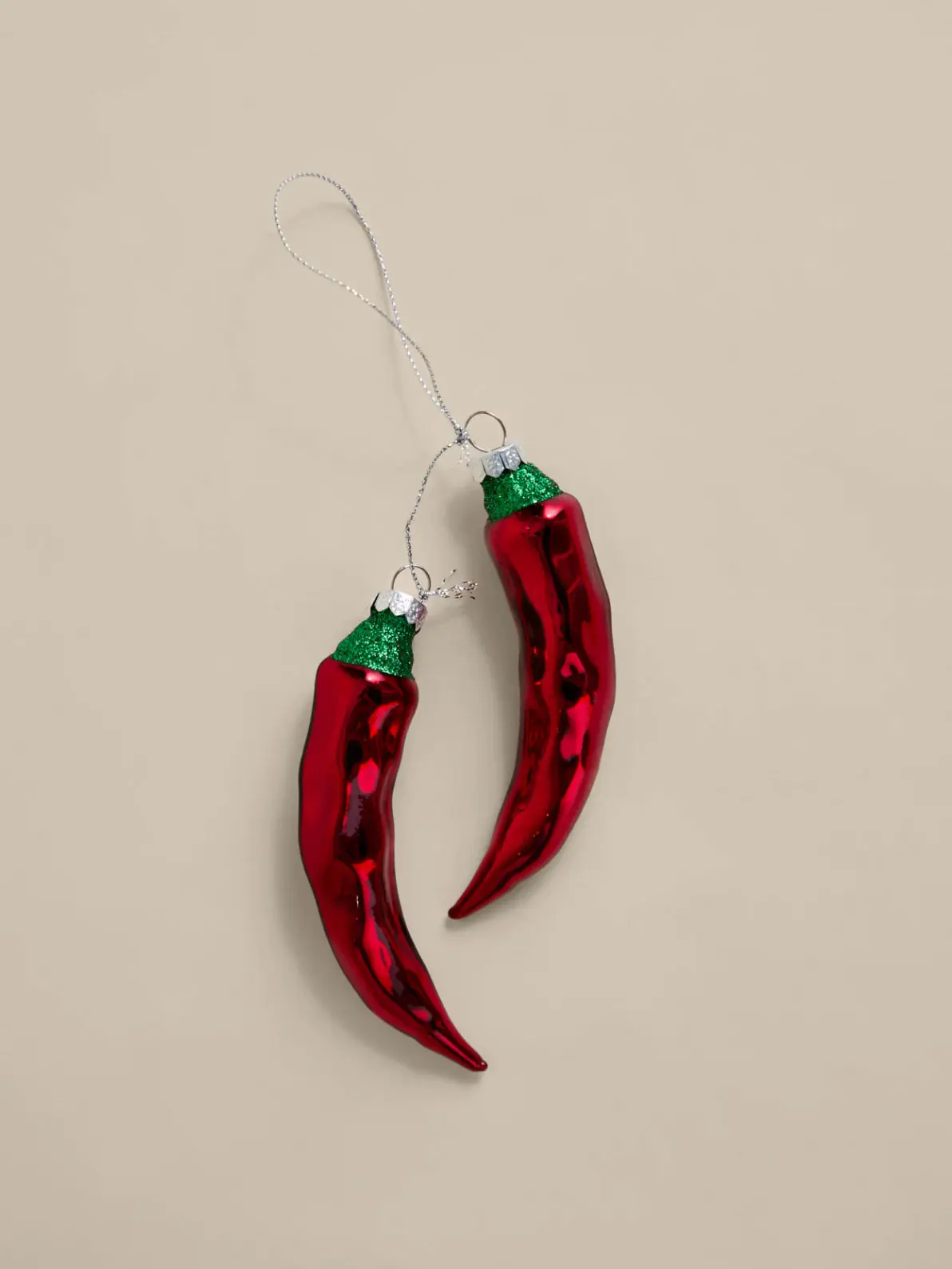 Image of two red chilli hanging decorations 
