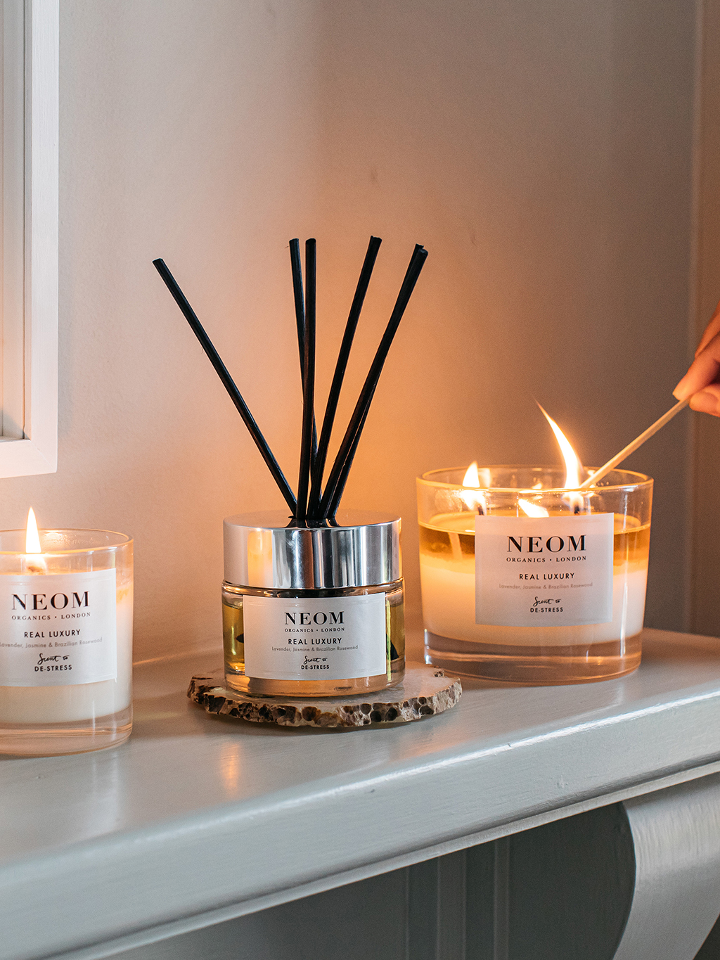 Neom room diffusers and scented candles. Shop now