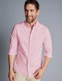 Man wearing pink shirt. Shop 4 for £149 Charles Tyrwhitt shirts & polos