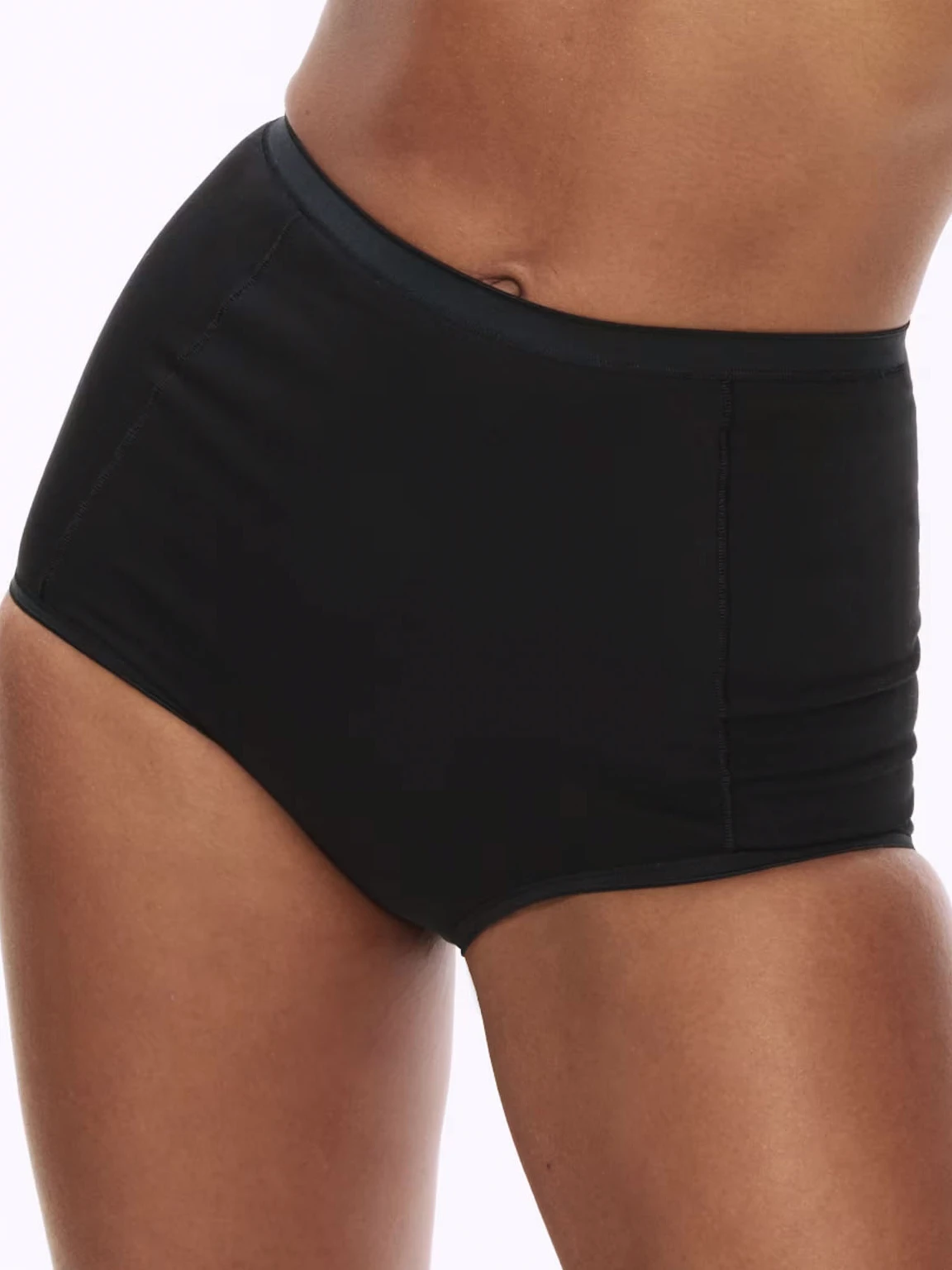 Woman wearing black high-waisted briefs