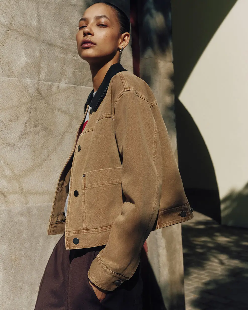 Woman wearing tan barn jacket from Hush at M&S