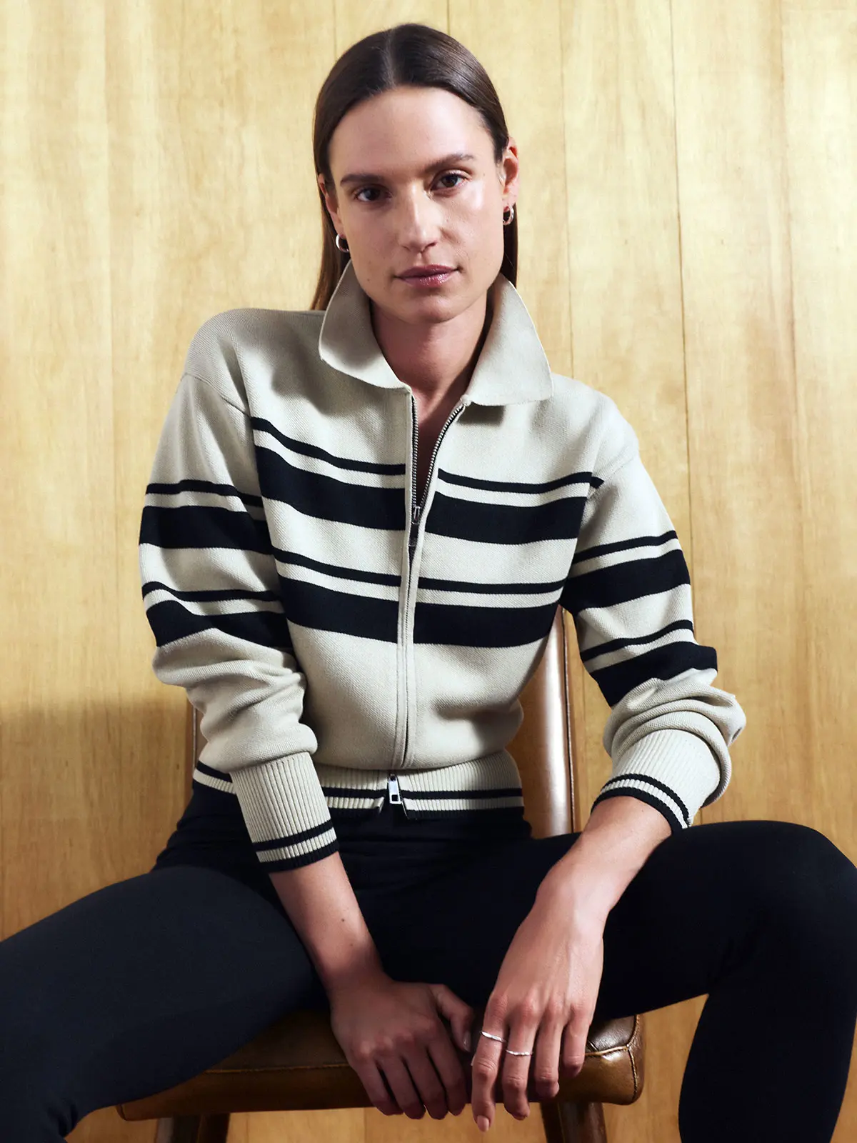 Woman wearing neutral striped knit