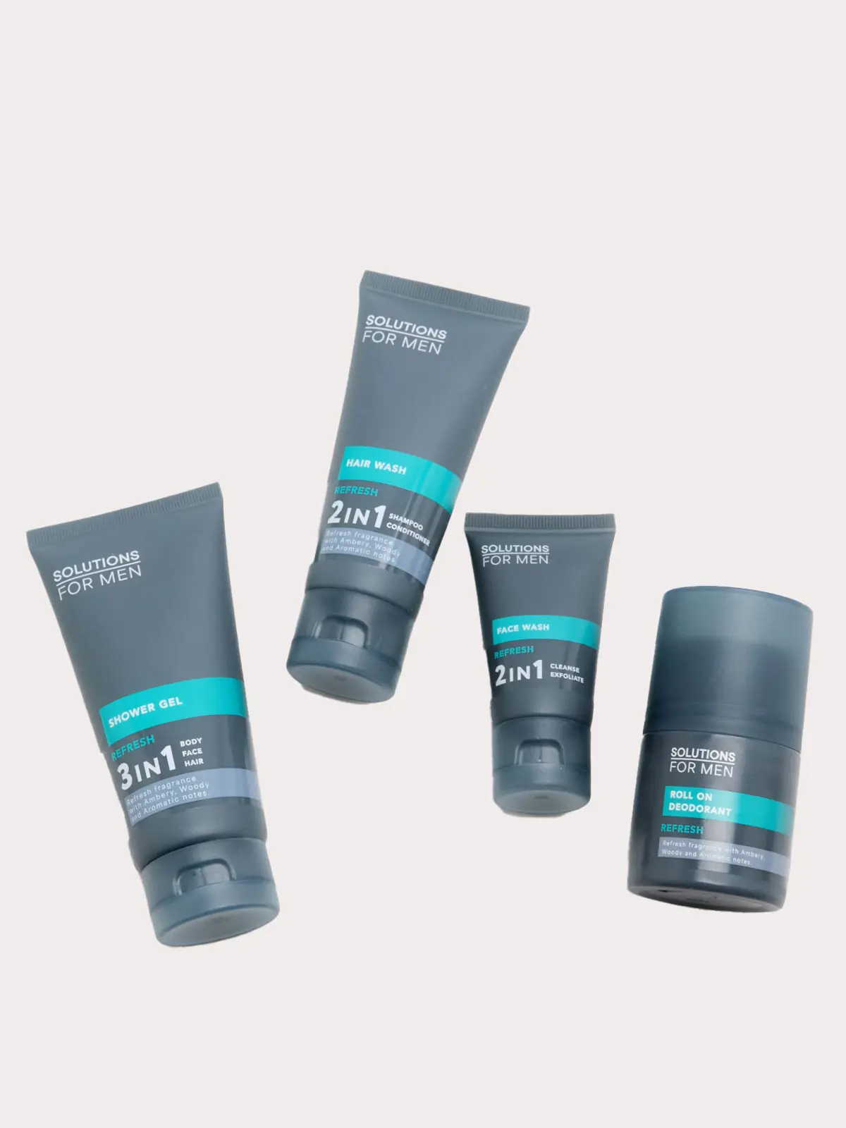 Set of four men's grooming products in grey and blue packaging 