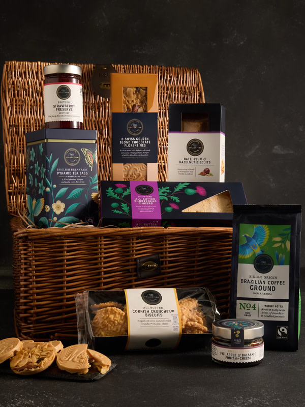 Hamper with crackers, tea, jam, and more