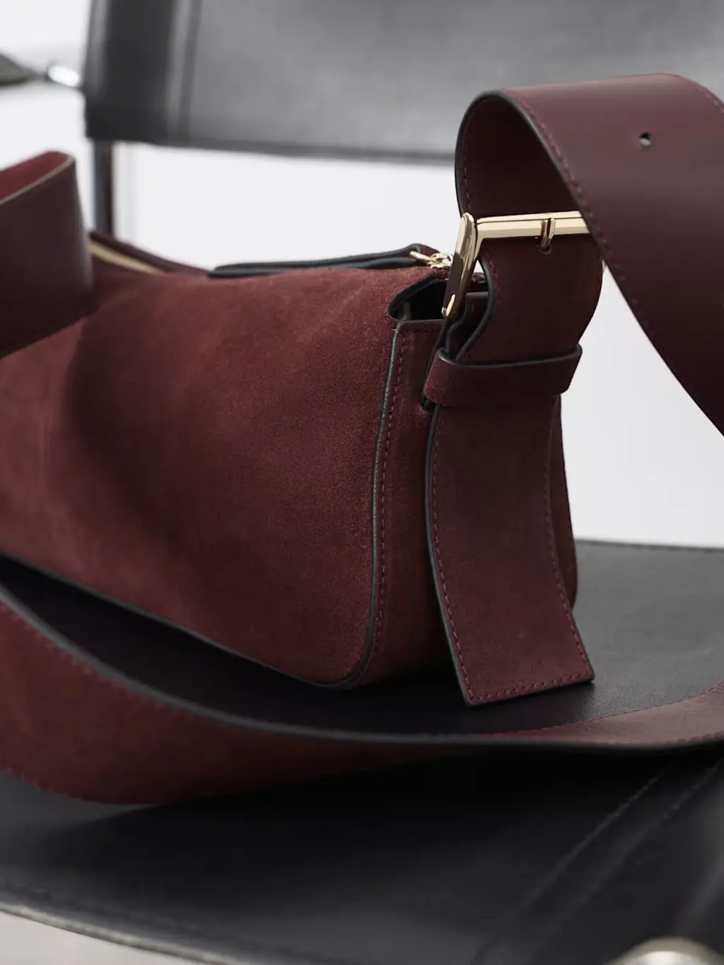 Suede crossbody bag with gold hardware