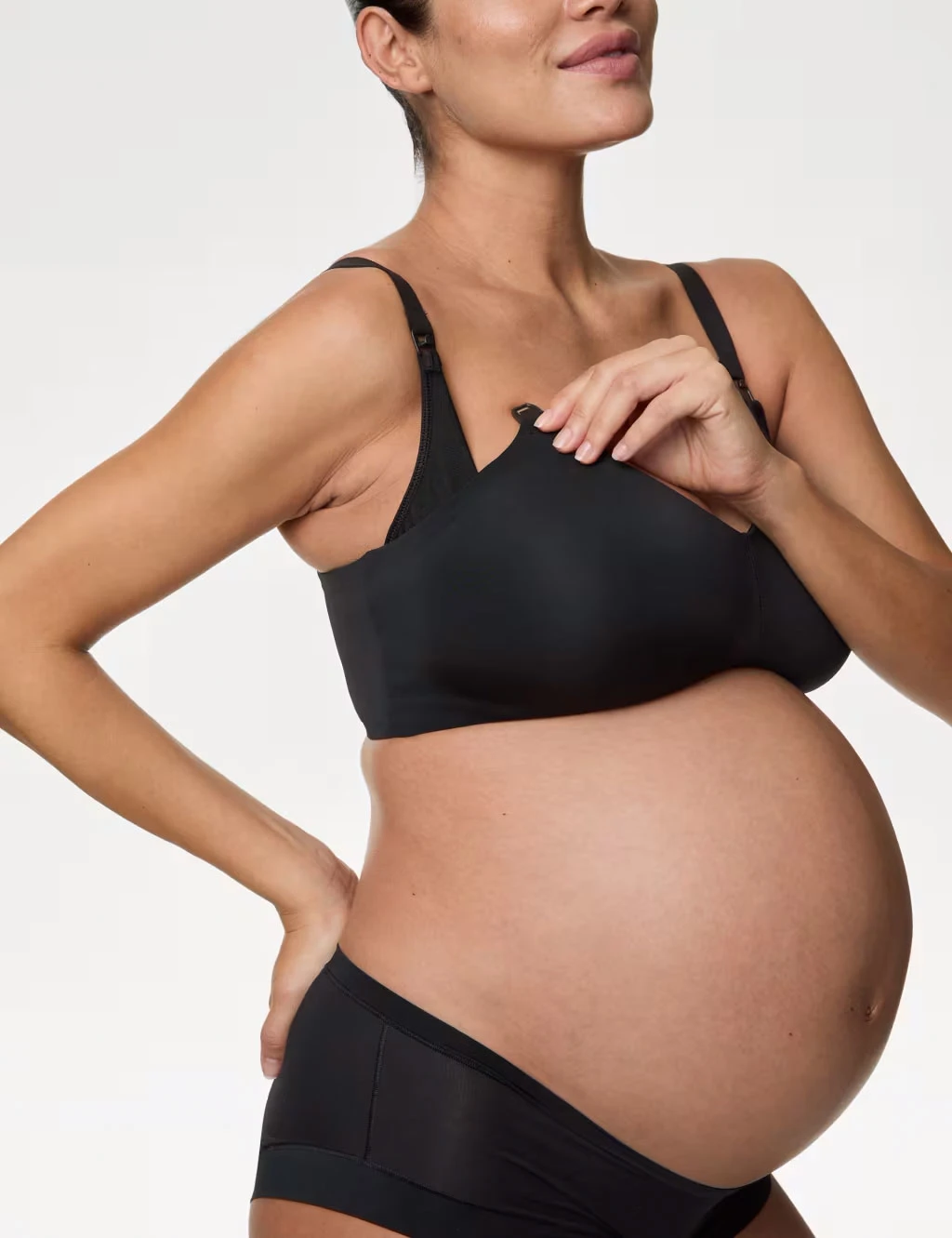 Woman wearing drop-down nursing bra
