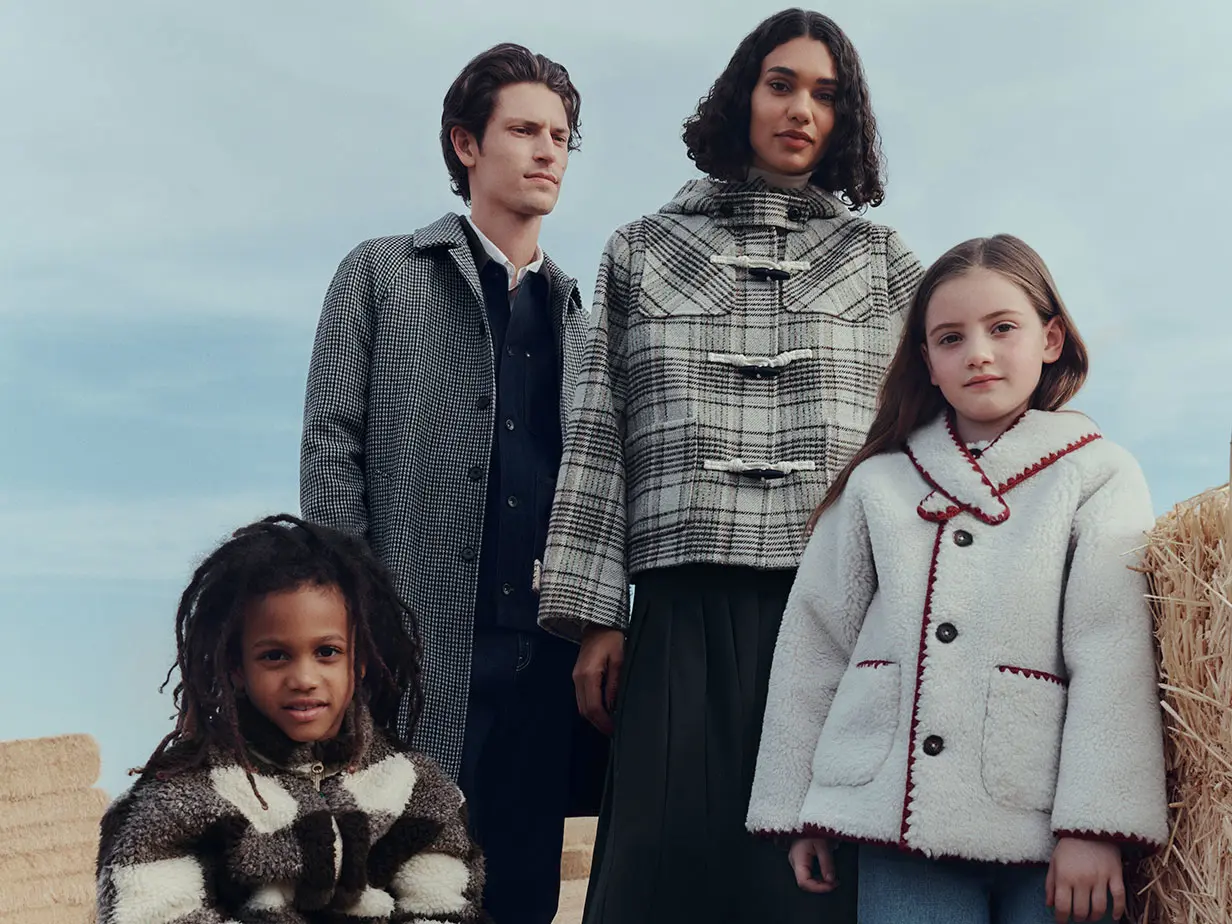 Group of adults and children wearing autumn clothing