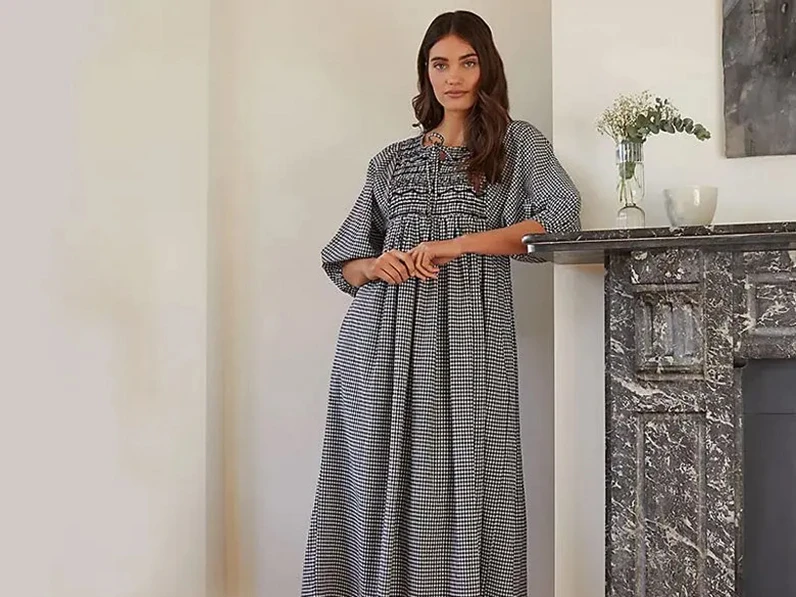 Woman wearing black and white gingham dress