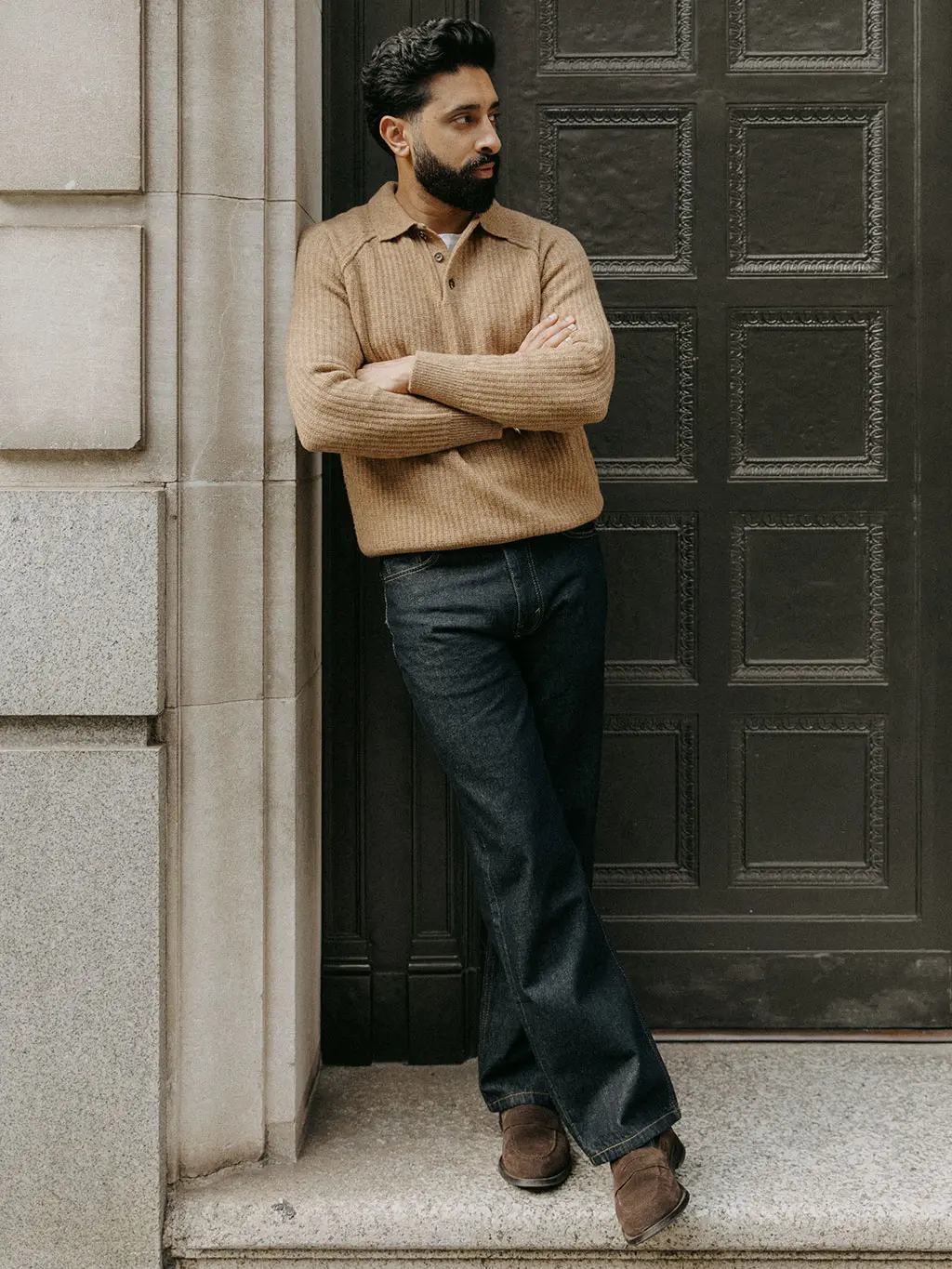 Gurj Sohanpal in tan jumper and dark jeans