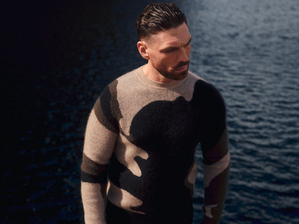 Man wearing black and brown jumper