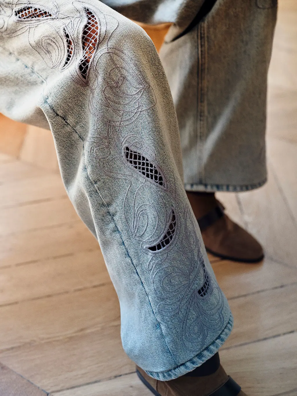 Close up of embroidered jeans