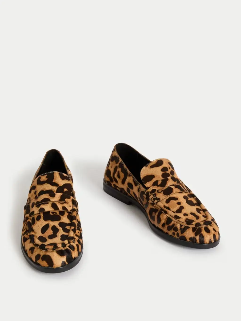 A cutout of leopard print loafers