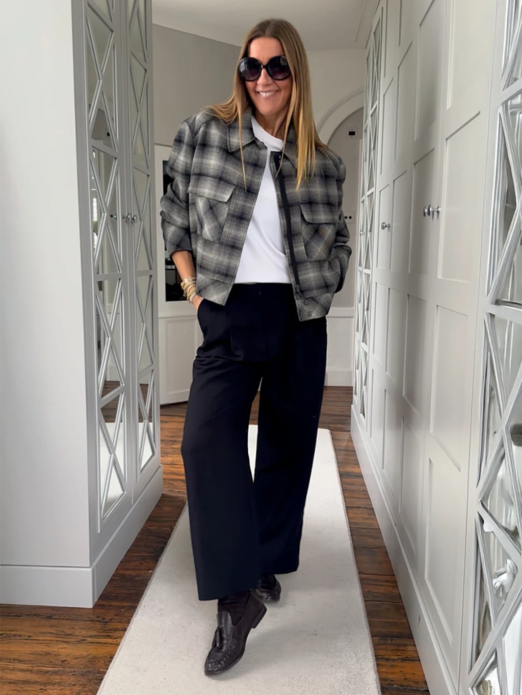 Hayley Karseras wearing a checked jacket by Autograph with a white T-shirt and black jeans