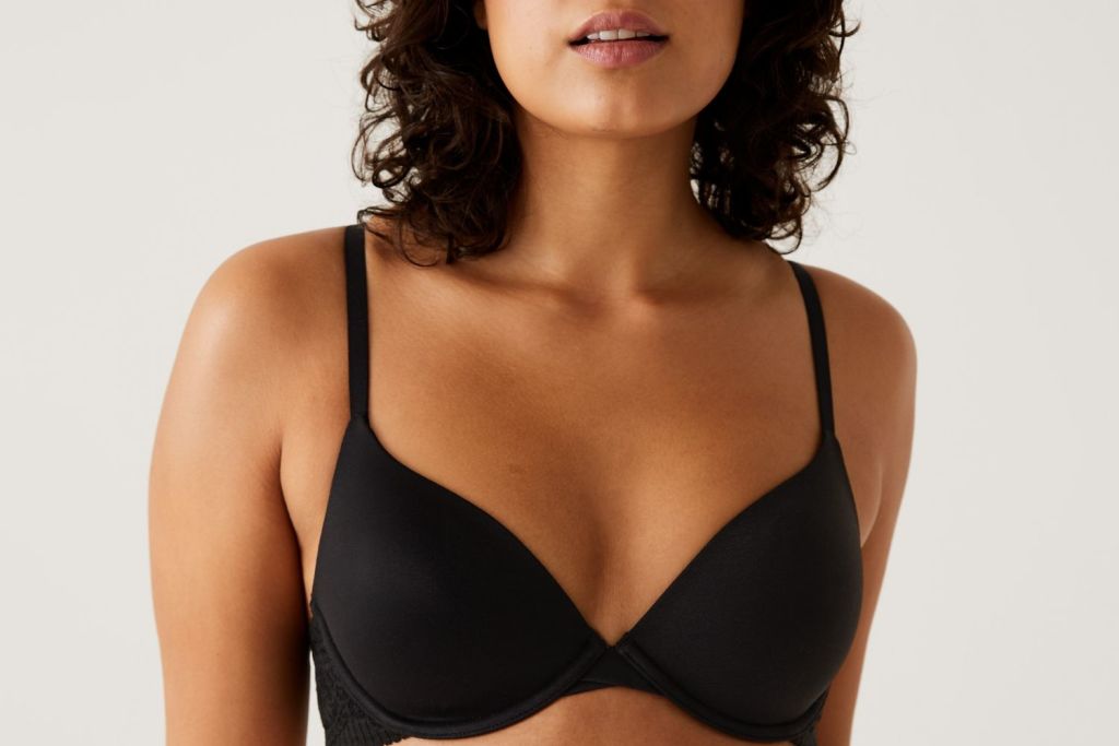 Woman wearing black plunge bra. Shop plunge bras