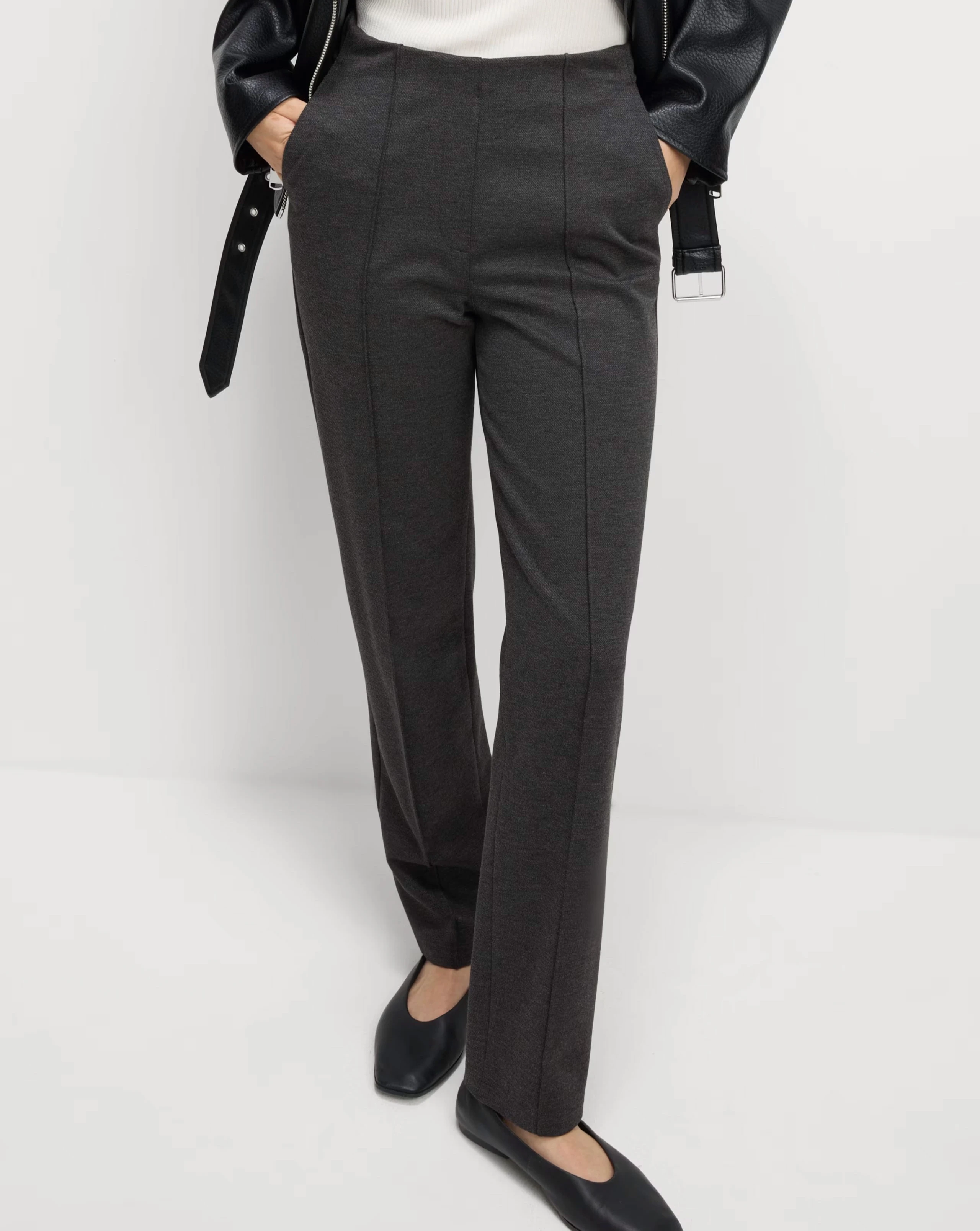 Woman wearing straight-leg trousers
