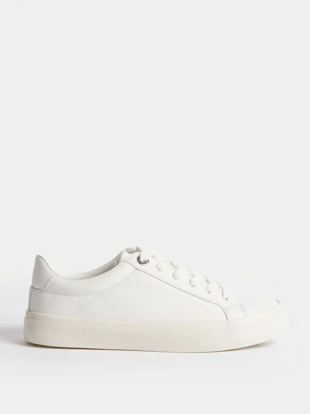 A cutout of white trainers, sideways view
