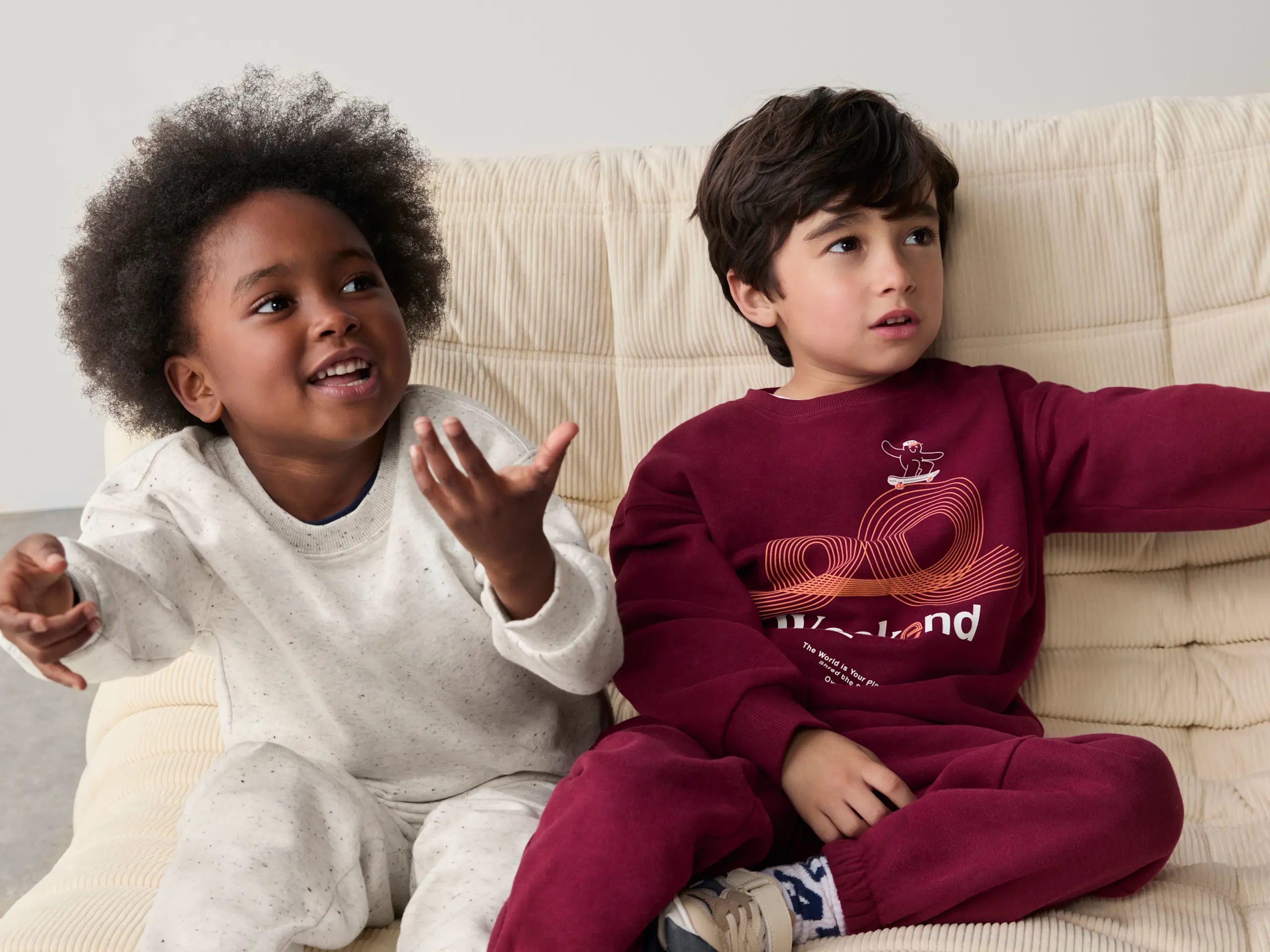Children wearing light grey and burgundy loungewear by M&S