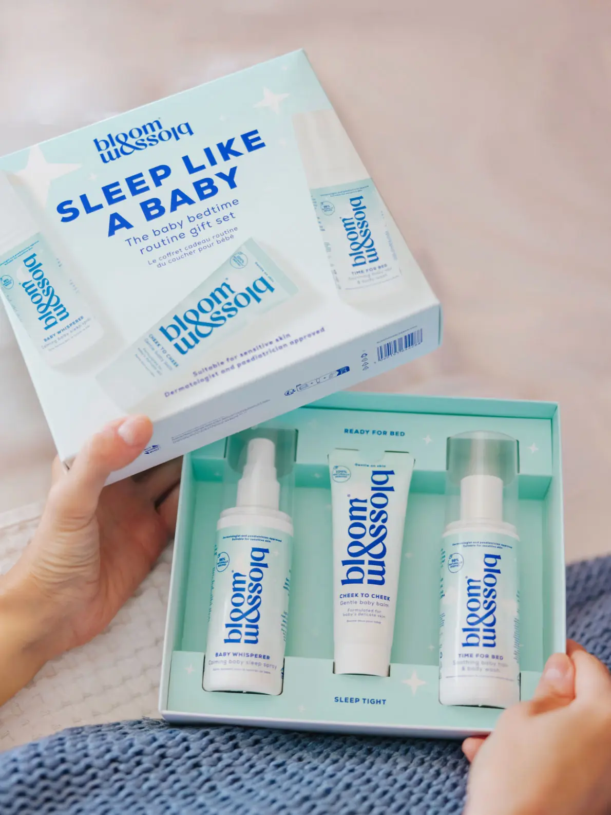 Gift box set of three baby products in white and blue packaging