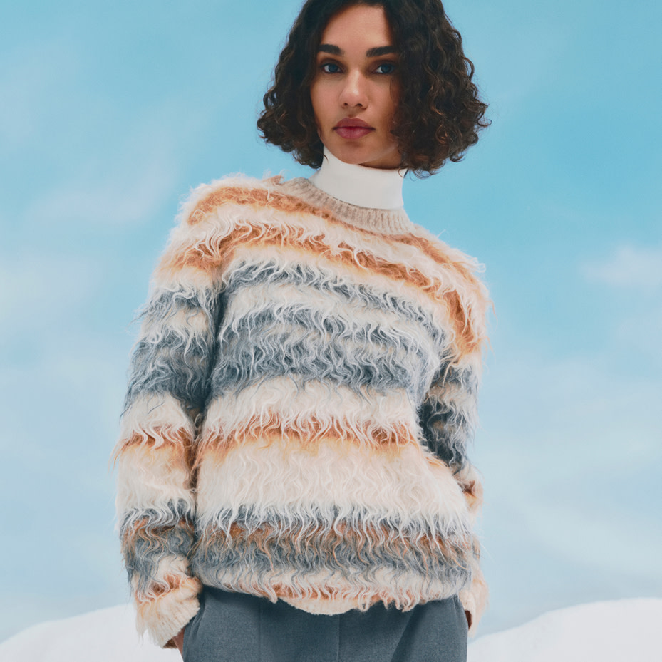 Woman wearing textured striped jumper