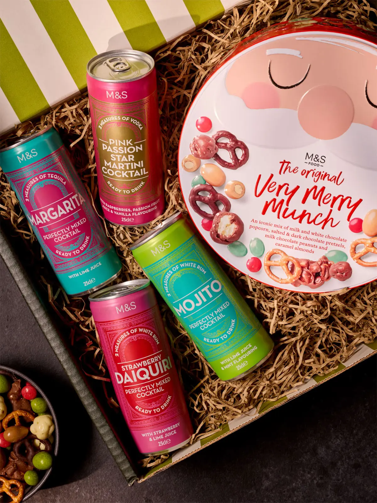 Hamper of four cans of alcohol and a tin of chocolates 