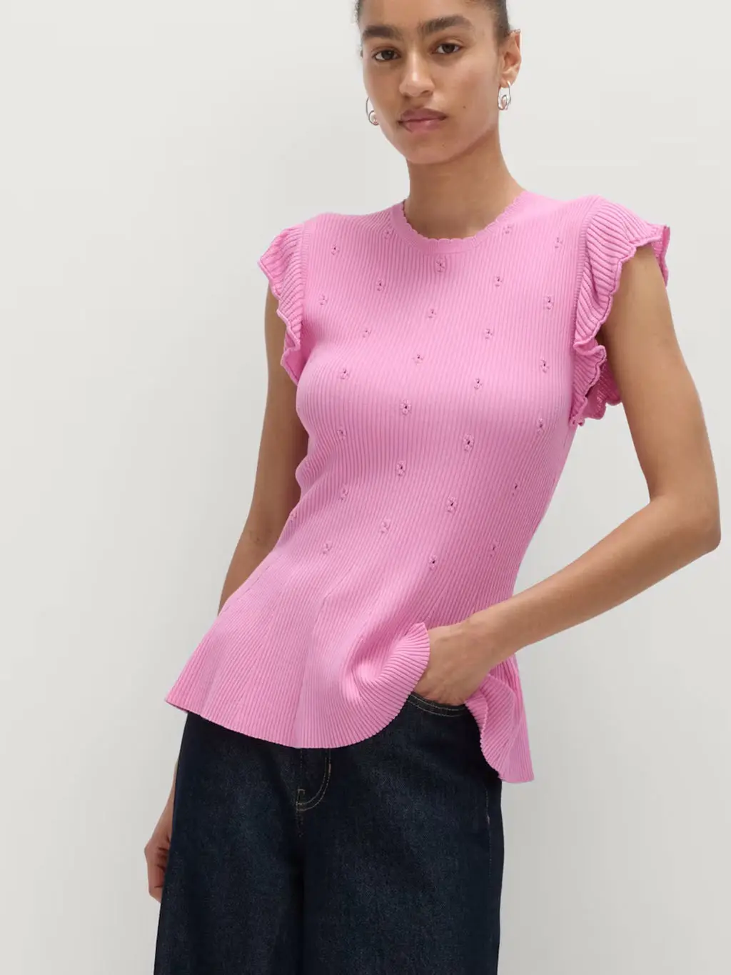 Pink eyelet-embellished knitted top