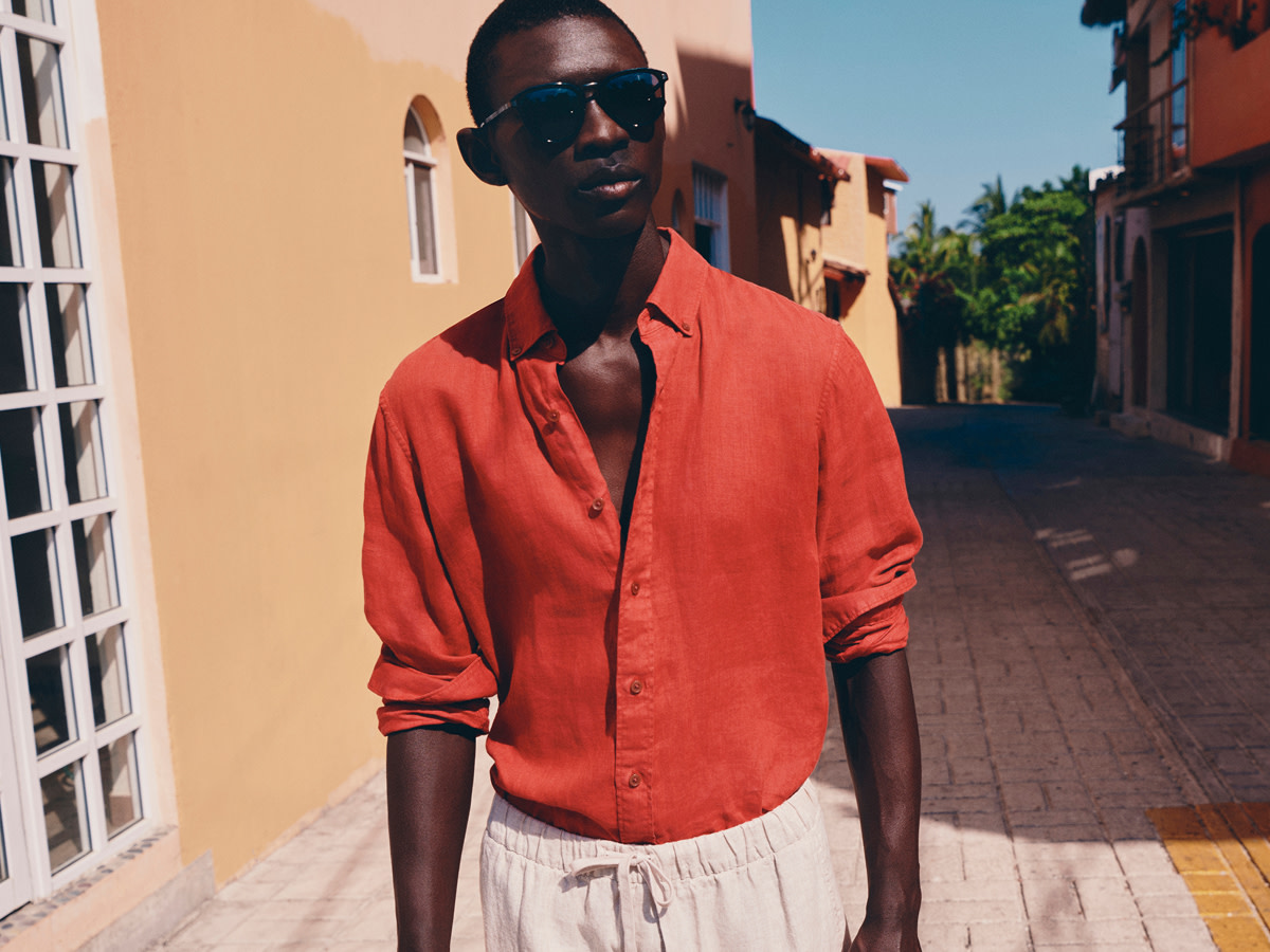 Man wearing orange shirt