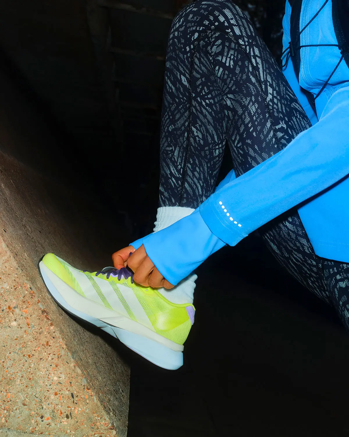 Woman wearing yellow adidas gym trainers