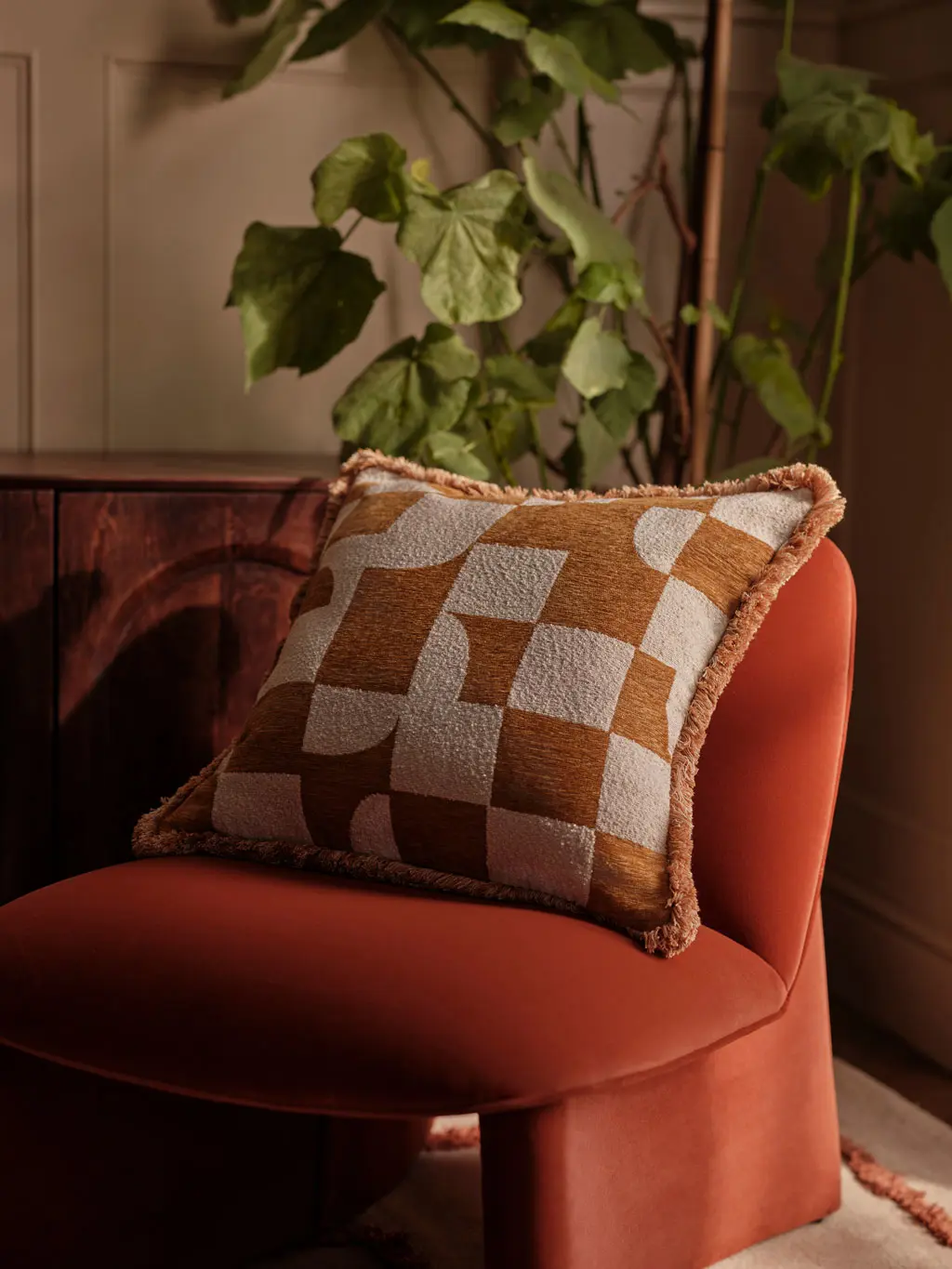 A gold and cream checked cushion