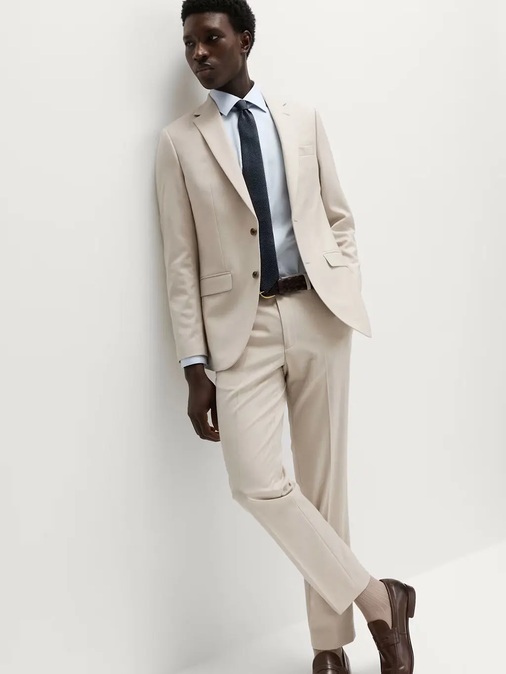Man in cream suit
