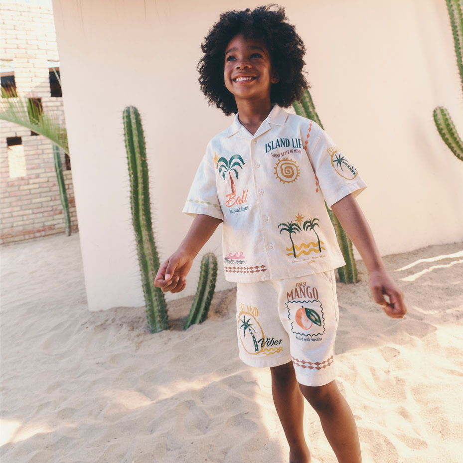 Boy in white shirt and shorts