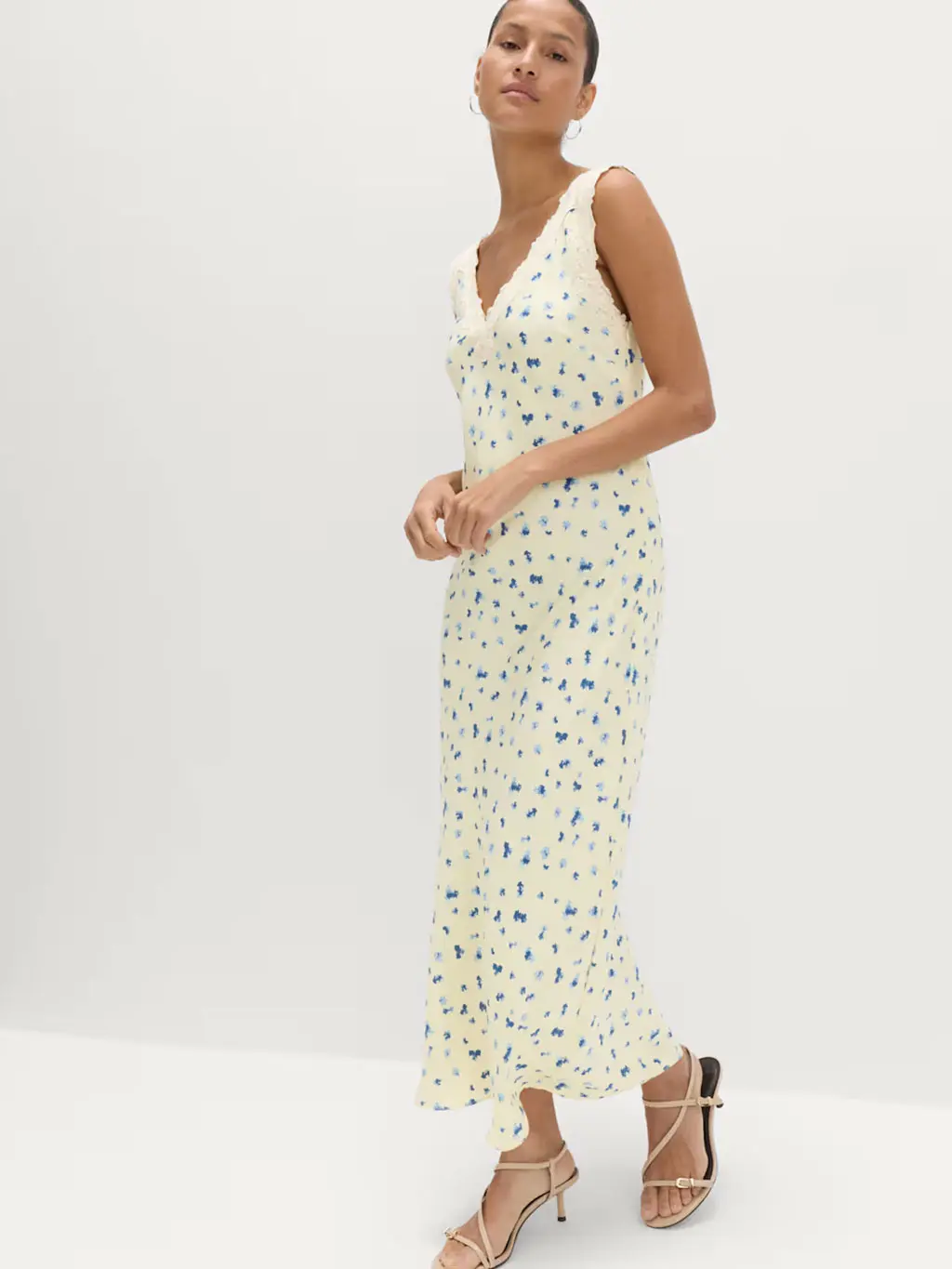 Woman wearing a floral-print yellow dress