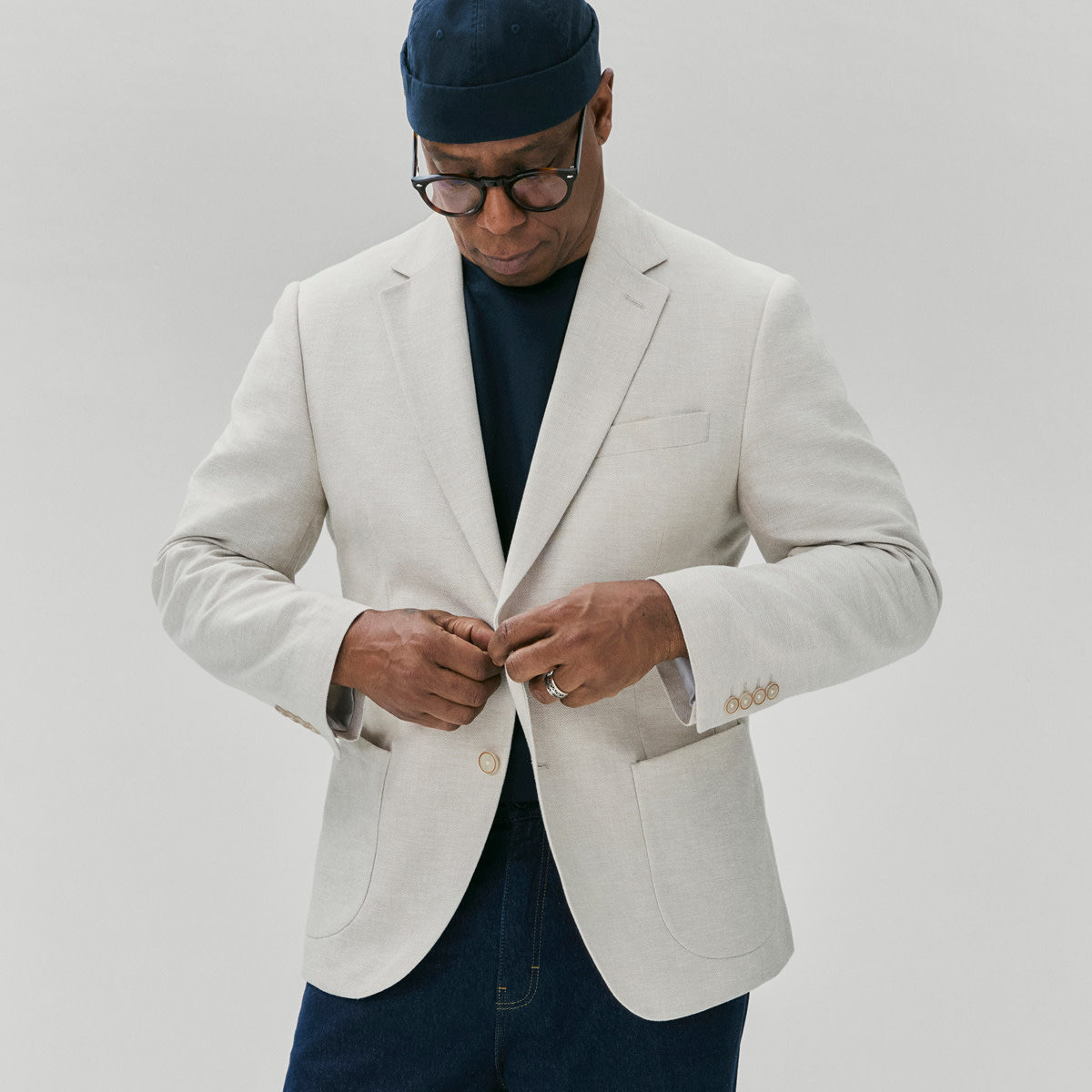 Ian Wright wearing grey jacket