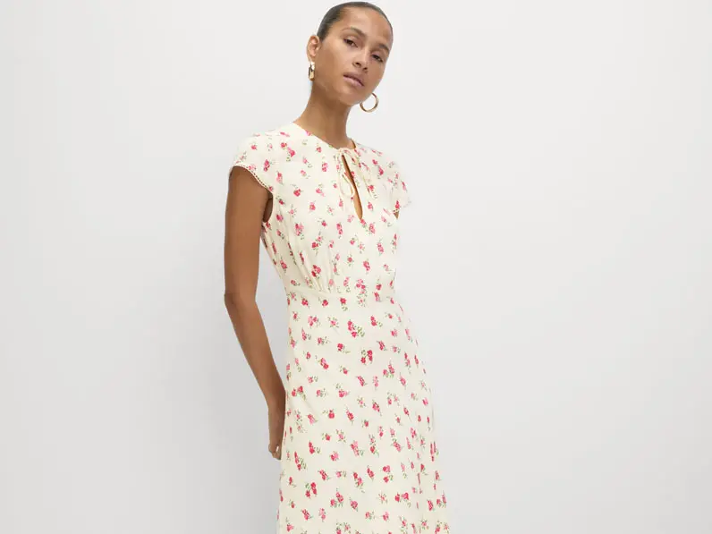 Woman wearing a floral print tea dress