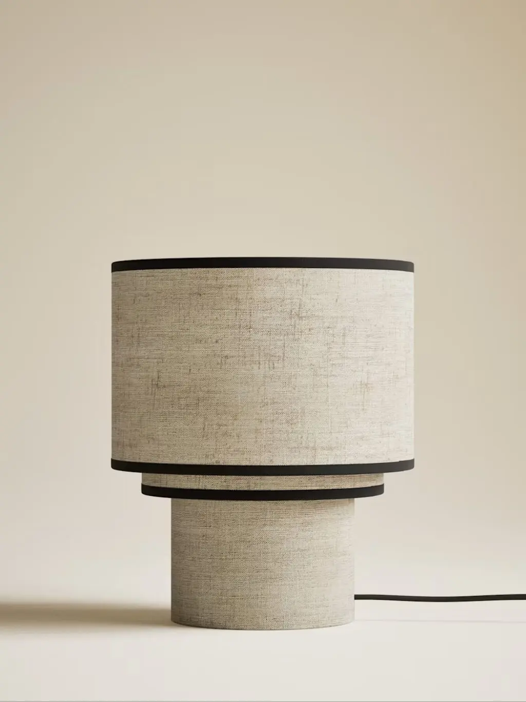 A natural table lamp with a black border by Kelly Hoppen x M&S