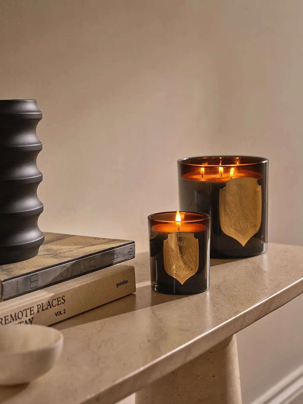 Two Kelly Hoppen candles on table