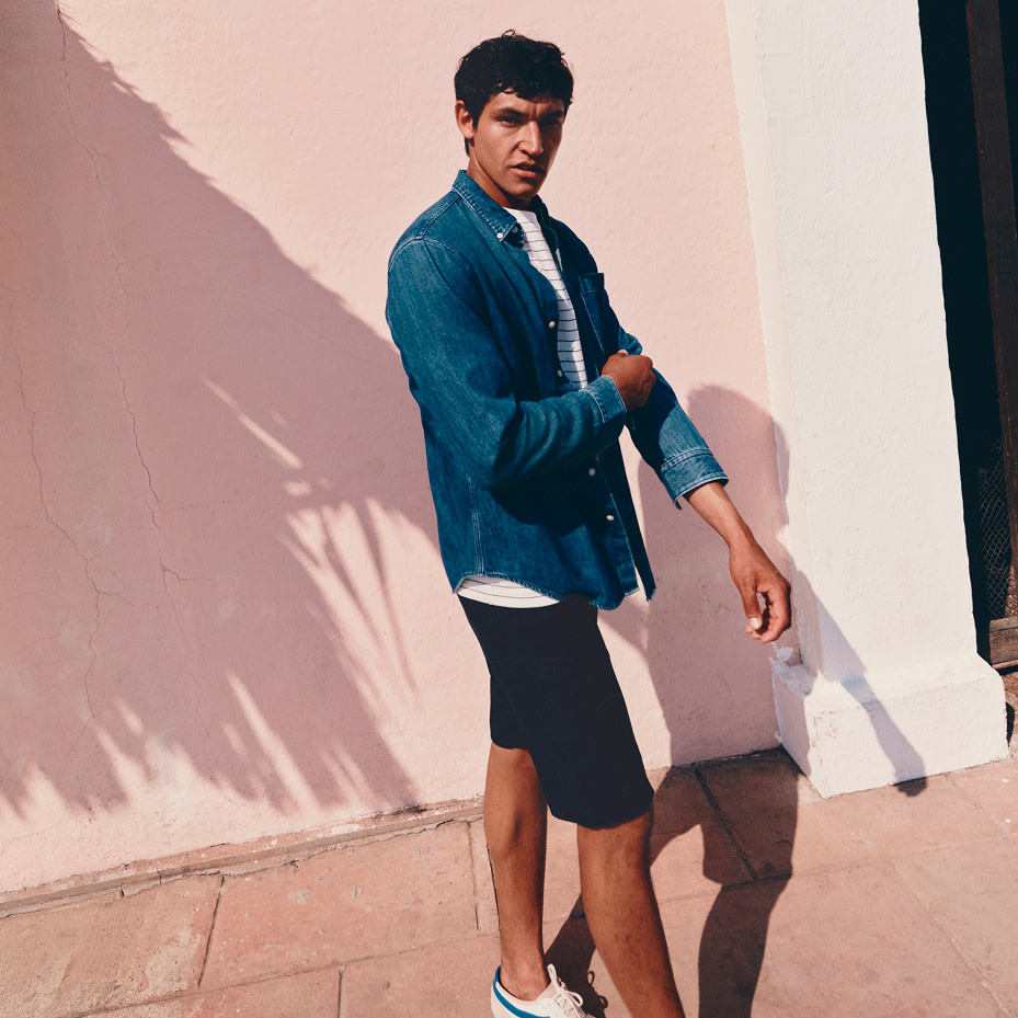 Man wearing  casual shirt and shorts