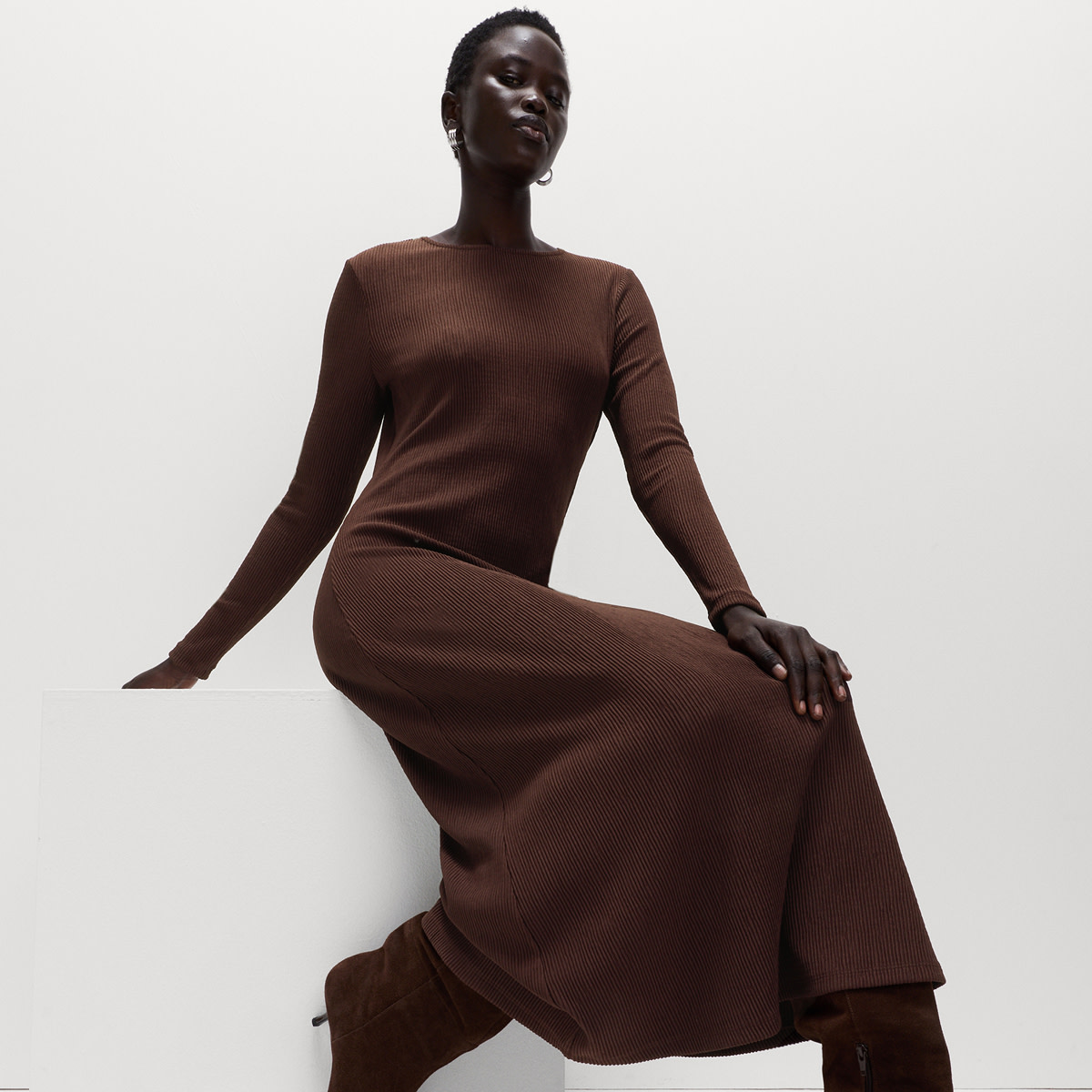 Woman wearing brown ribbed dress