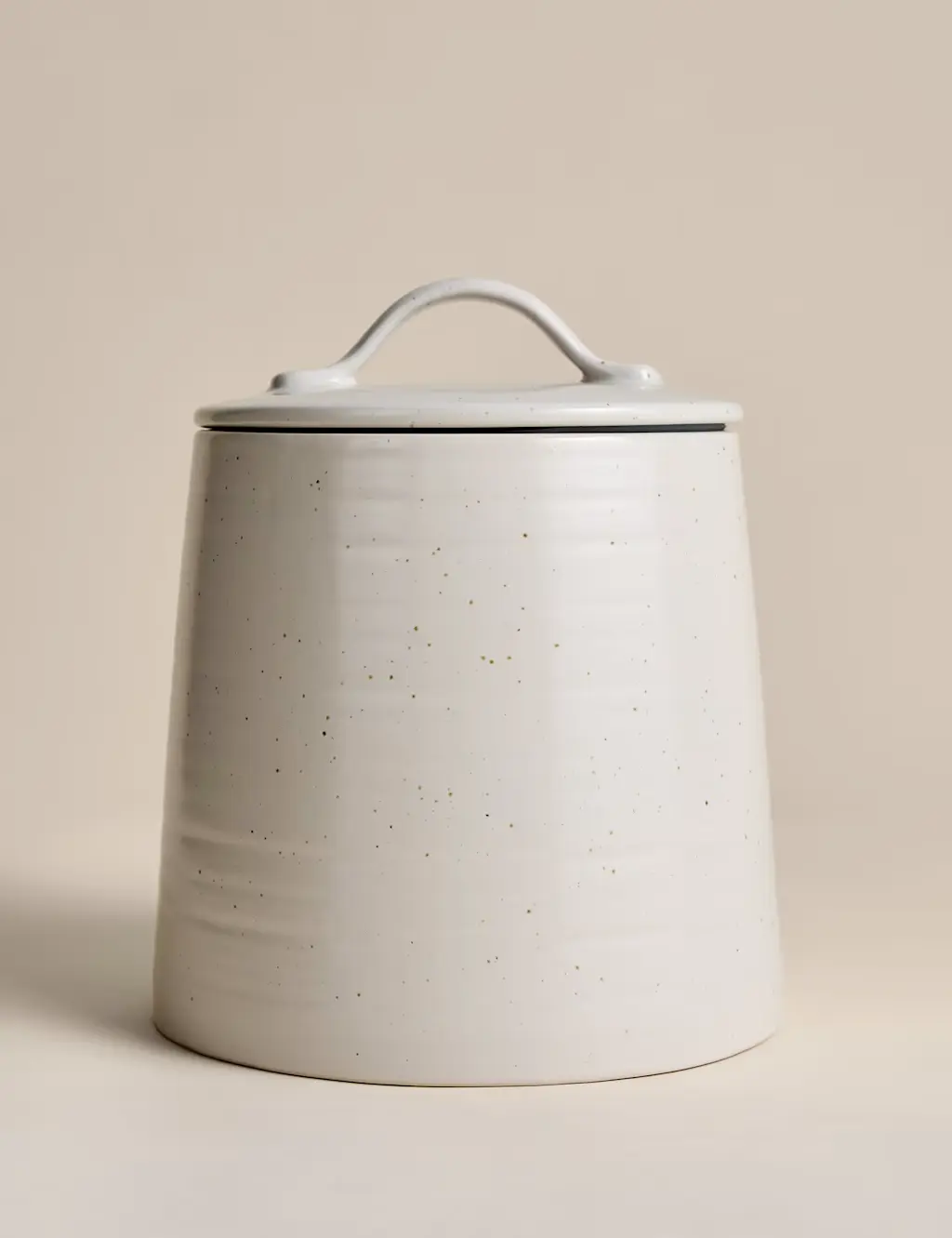 Beige cookie jar with lid