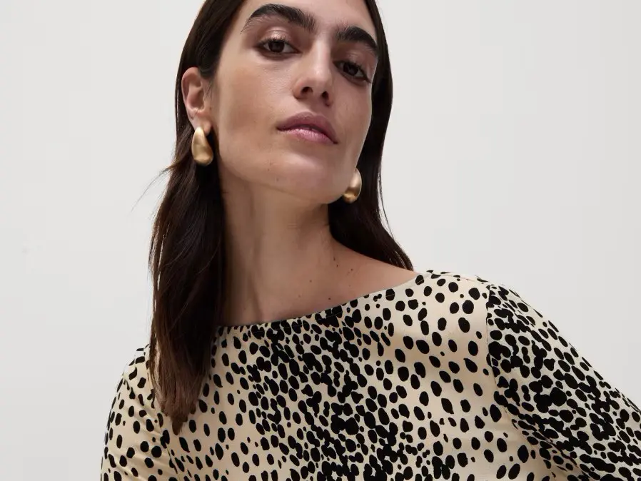 Woman wearing animal print dress at M&S