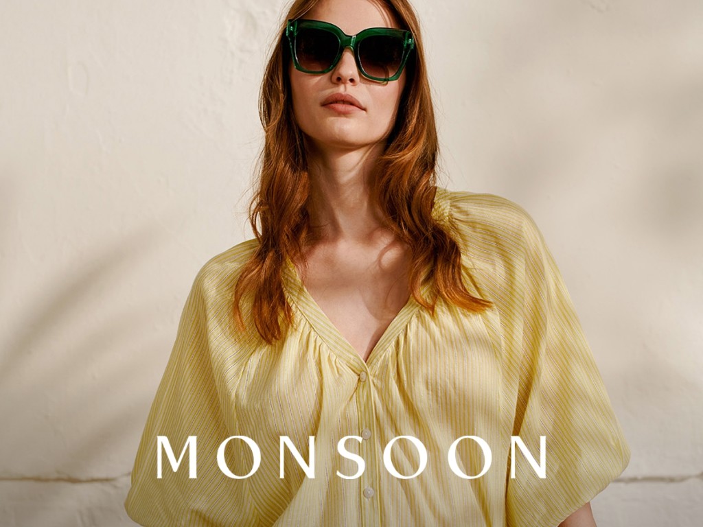 Woman wearing yellow top. Shop Monsoon