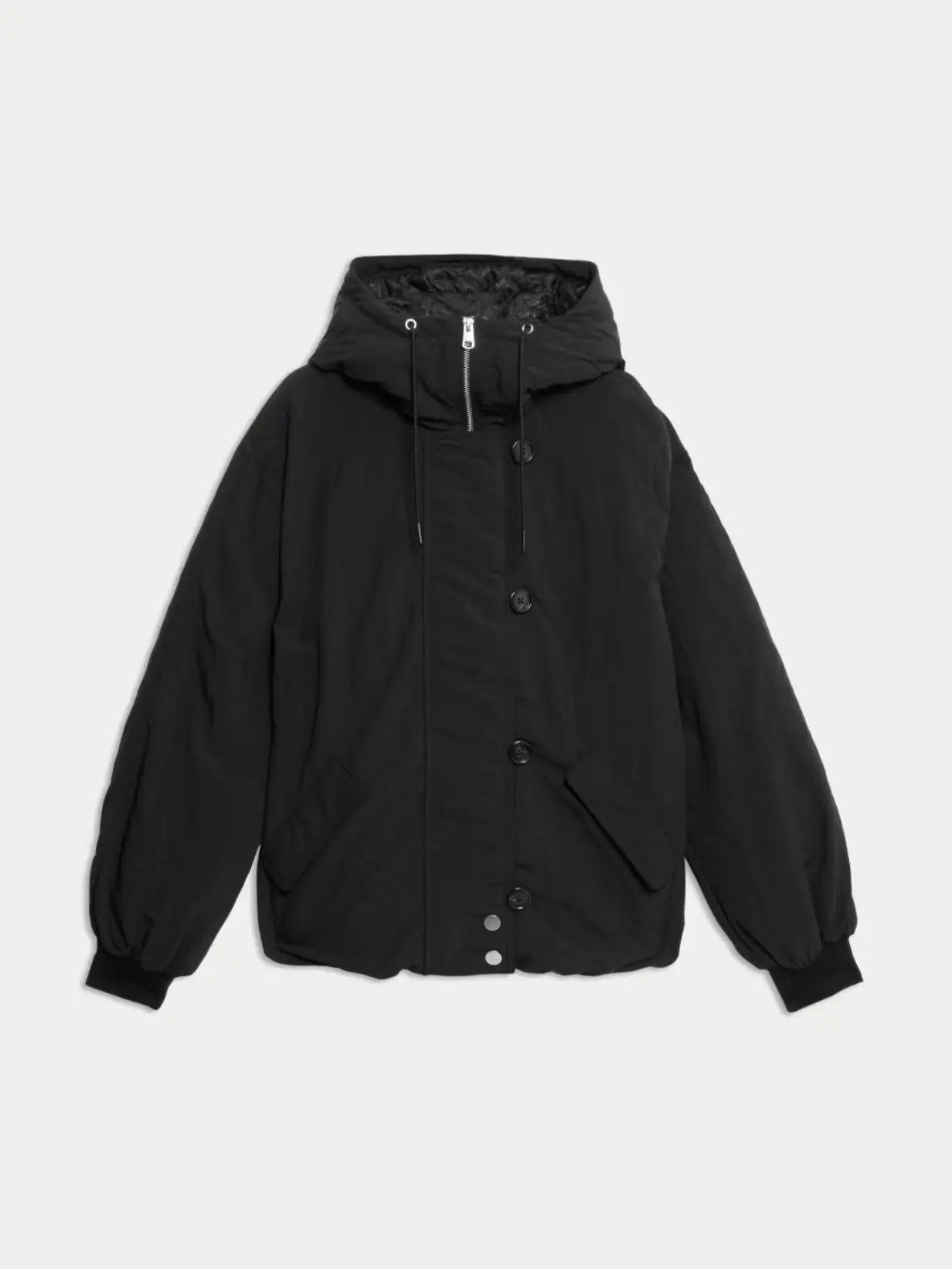 A cut out of a black bomber style puffer jacket against a light background